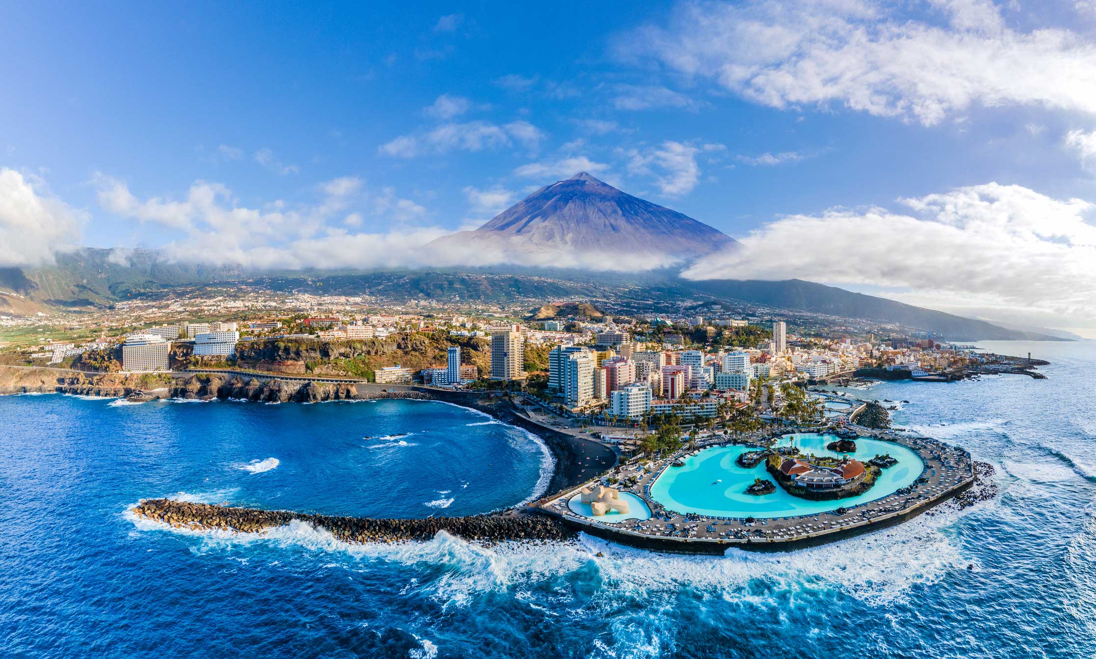 Aerial view with Puerto de la Cruz, in background Teide volcano, Tenerife