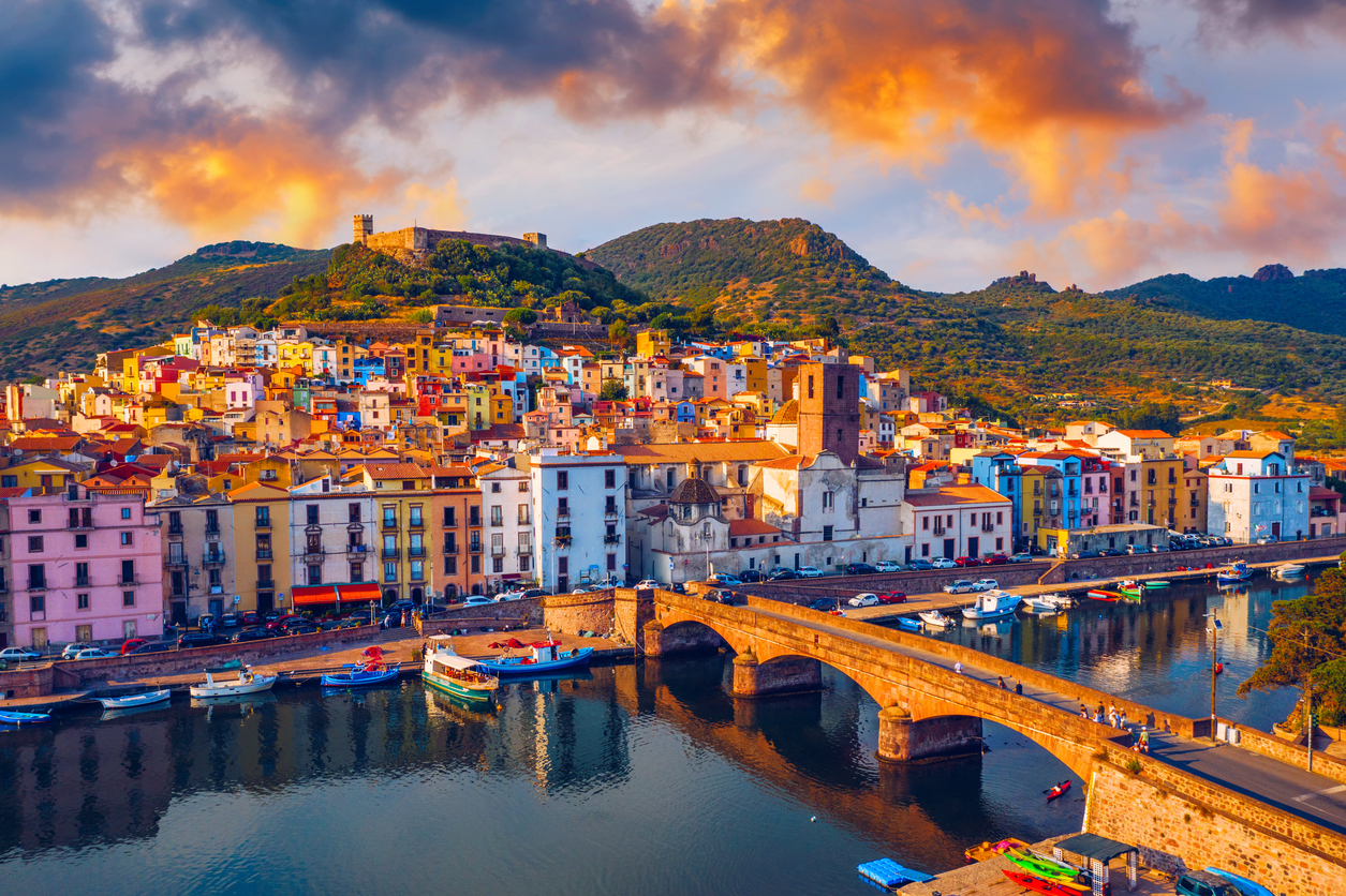Beautiful view of Bosa town, Sardinia island, Italy. Travel destination. Bosa town with Ponte Vecchio bridge across the Temo river. Marvelous morning view of Sardinia island, Italy, Europe.