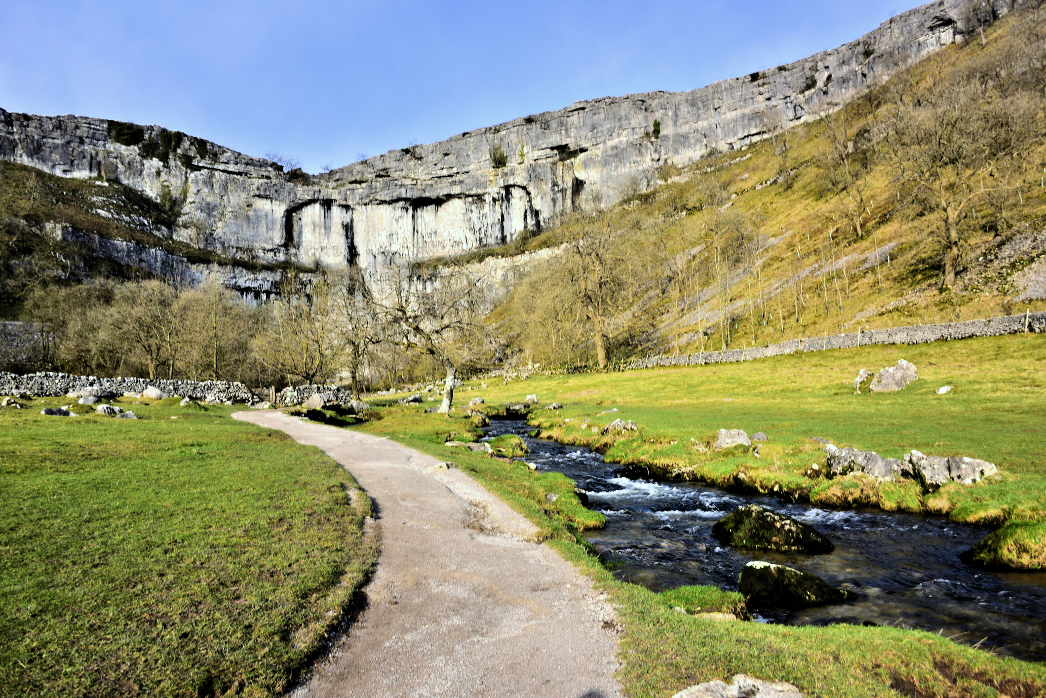Malham Cove as seen from the approach path, with Malham Beck 