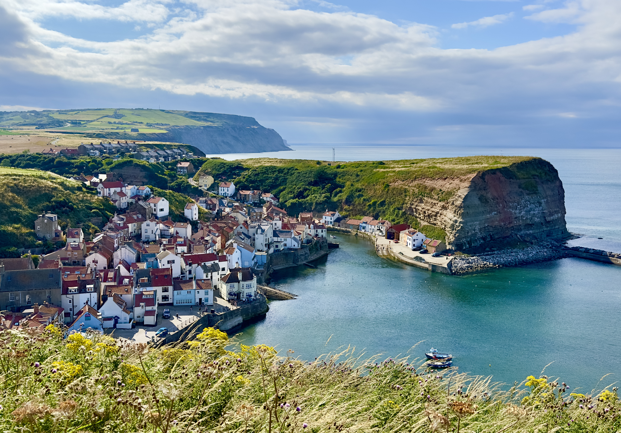 A high angle view of the harbourfront village of Staithes in North Yorkshire, UK.