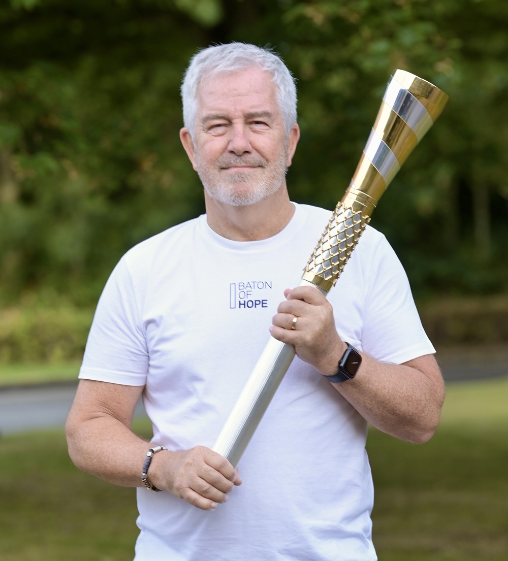 Mike McCarthy holding the Baton of Hope at the start of the Blackpool tour