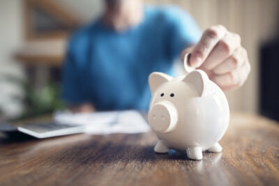 Financial health - man with piggy bank