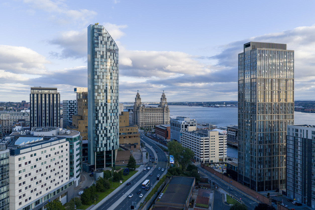An aerial photograph of Liverpool skyscrapers and Liverpool Pier Head near the Waterfront. The photograph was created on a summer afternoon in Liverpool, Merseyside, England. Several new skyscrapers can be seen in the foreground.
