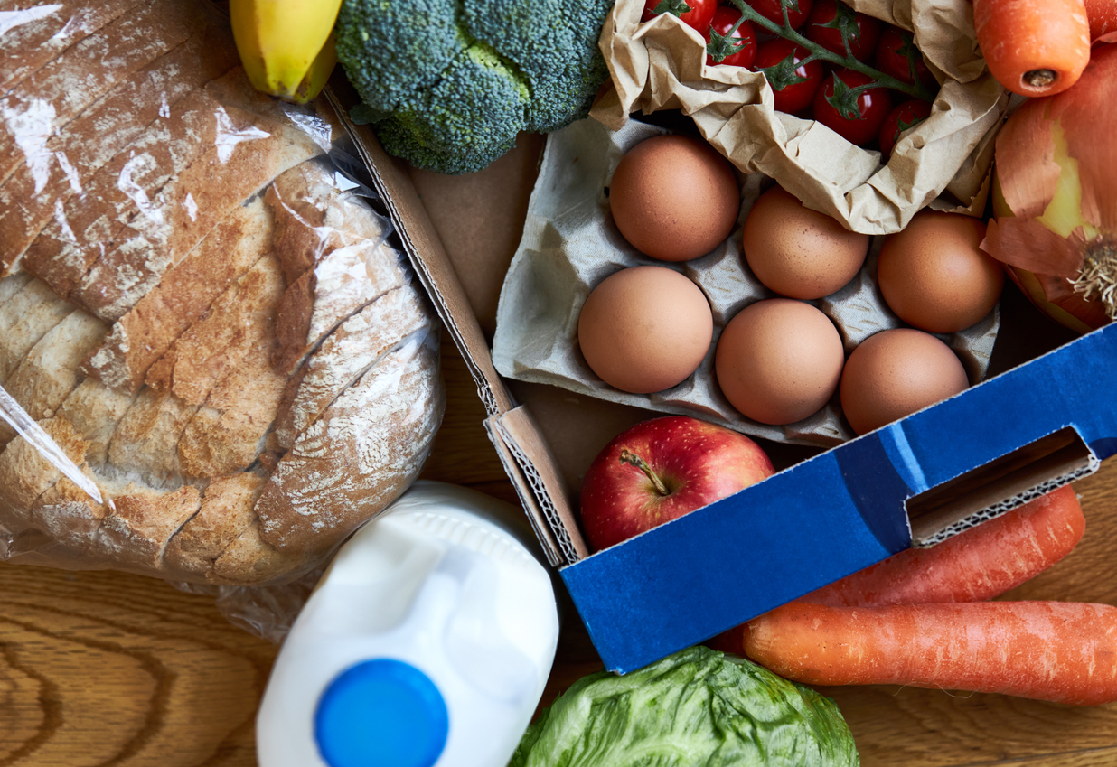 Fresh market box delivery full of fruit and veg taken from above.