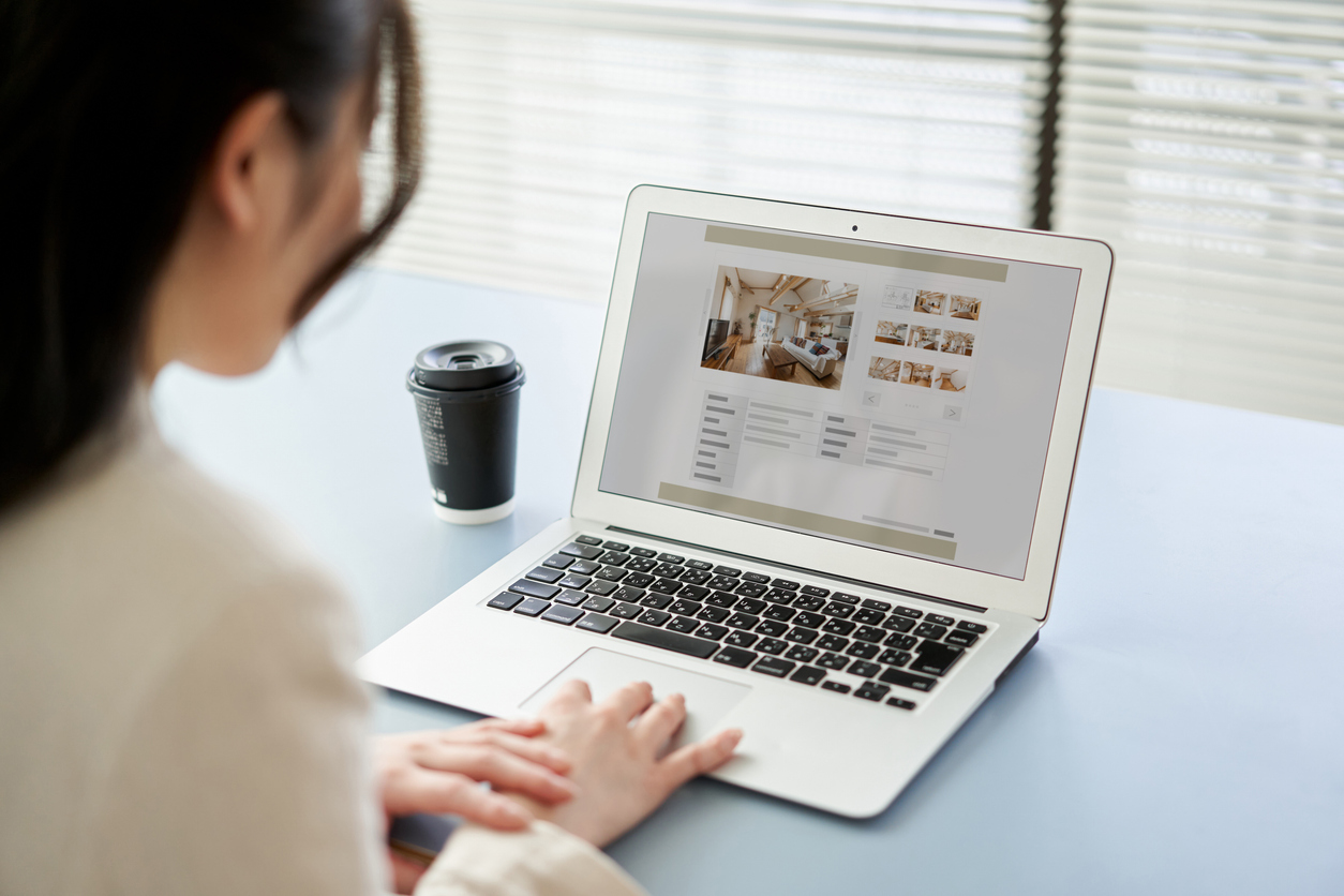 Woman looking at house online