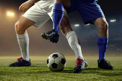 Intense football rivalry moment with two professional players