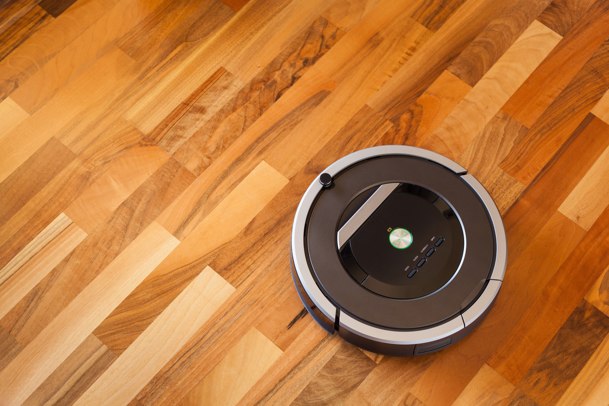 robotic vacuum cleaner on laminate wood floor smart cleaning technology