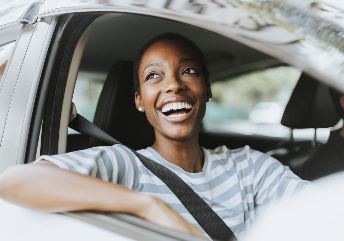 Cheerful woman in a car