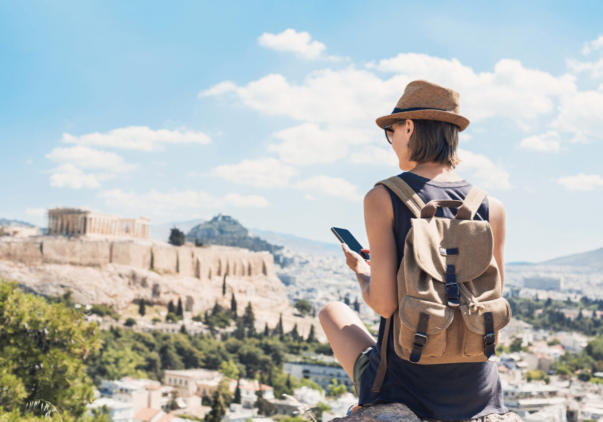 Young woman using phone with Global eSIM