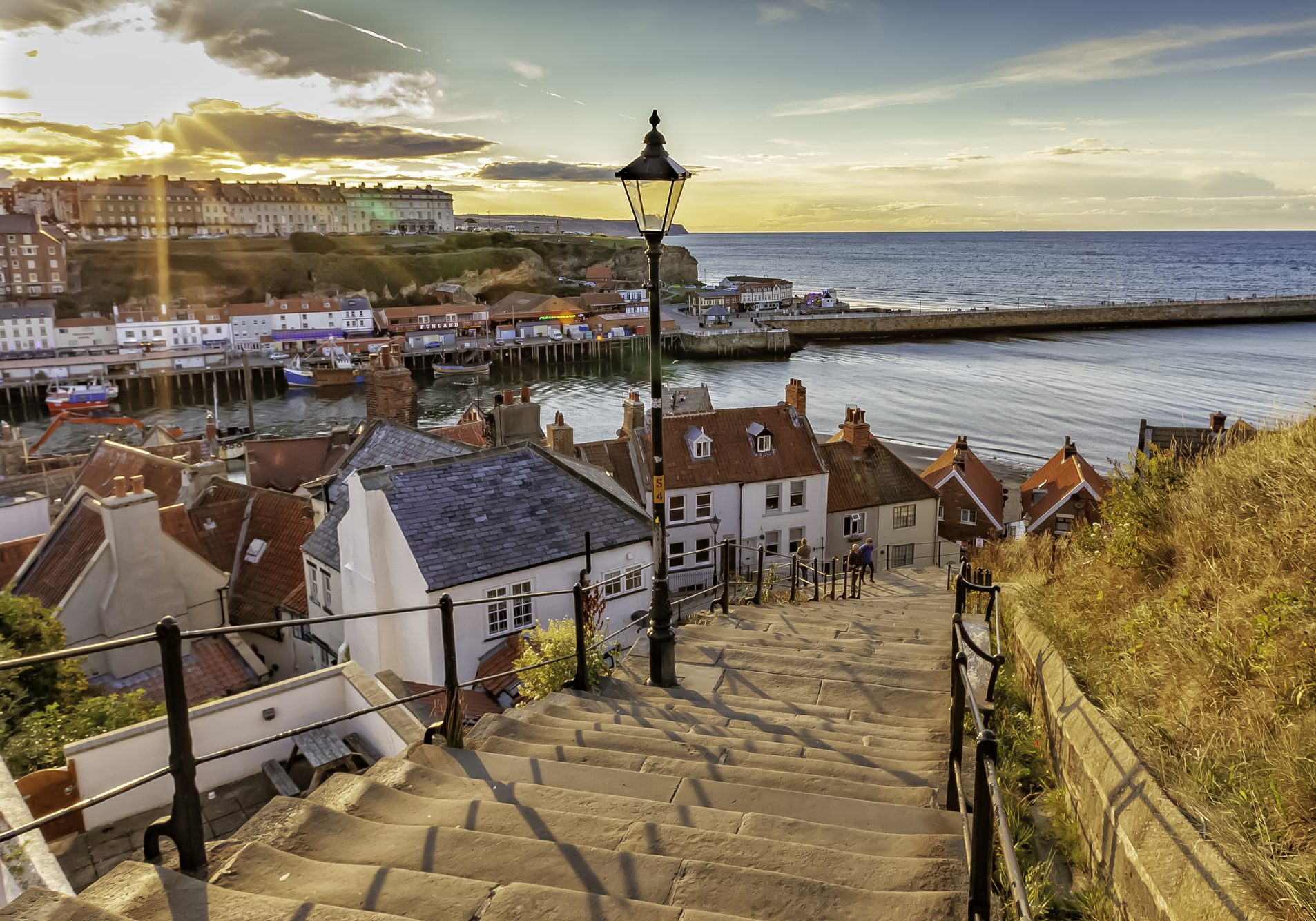 Sunset over the famous 199 steps at Whitby, North Yorkshire Coast, England, UK