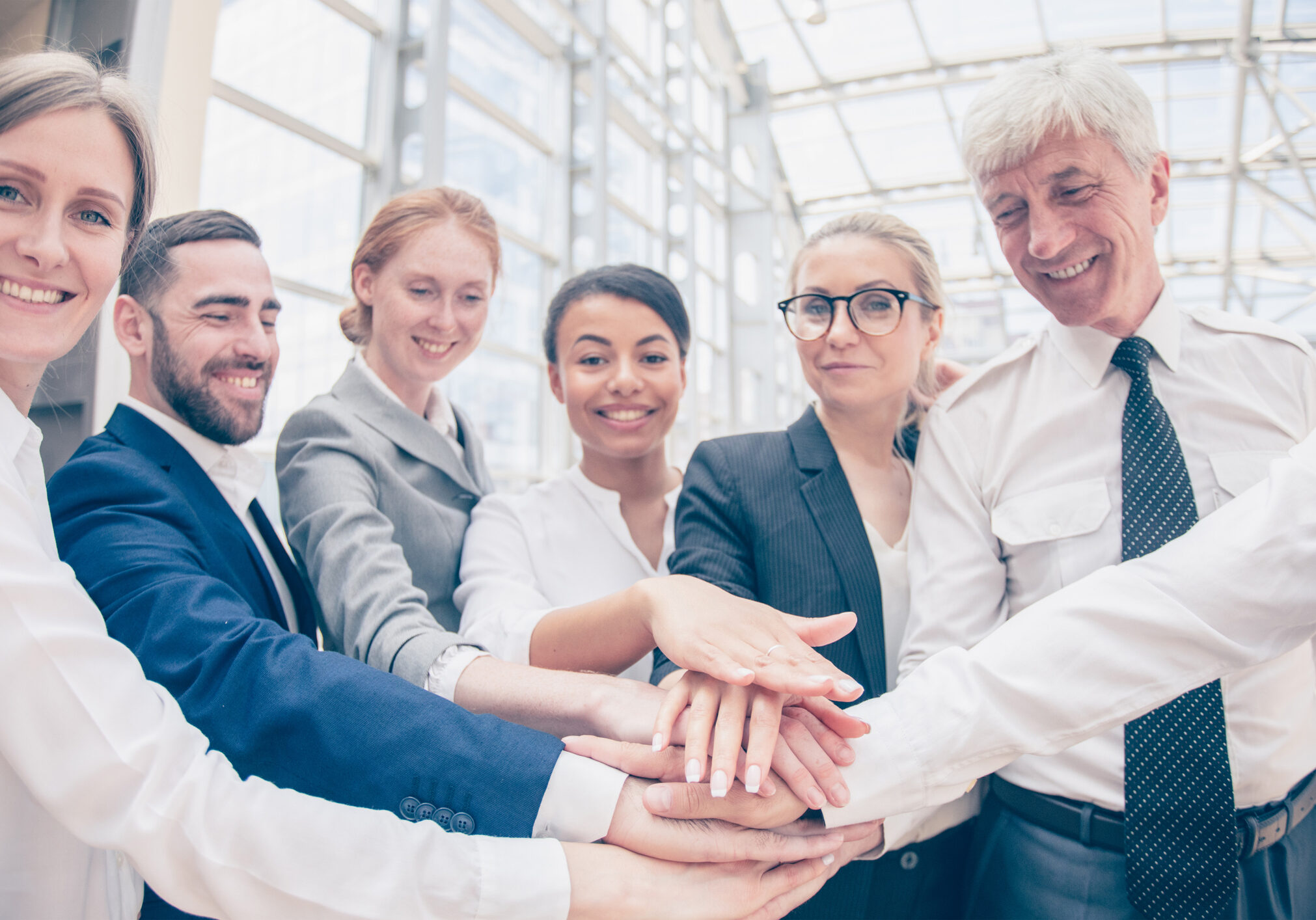 Business people happy team stack hands support concept