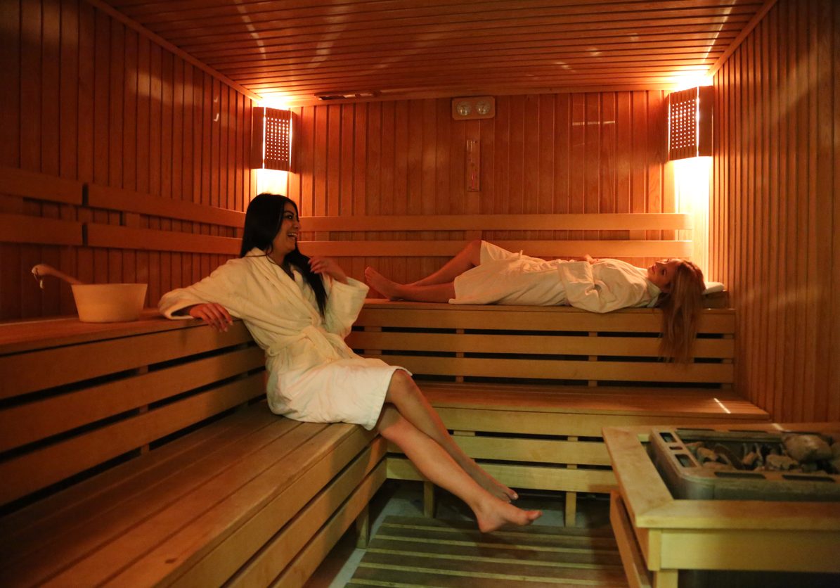 two beautiful young women in sauna