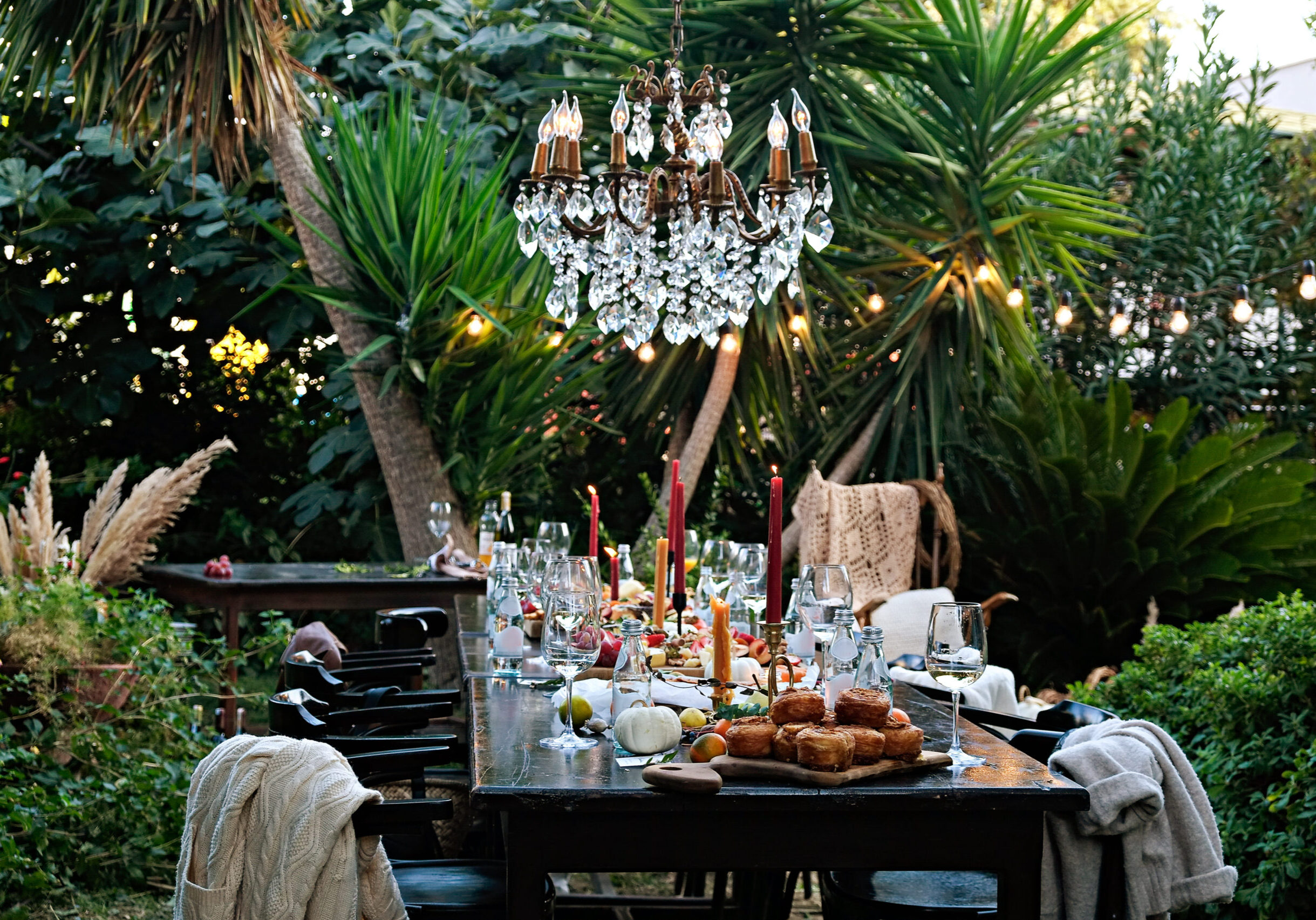 Banquet table setting and arrangement. Holiday table beautifully set with floral decoration. Close up, copy space, background.