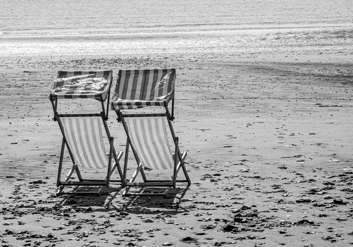 Deck chairs on a deserted beach