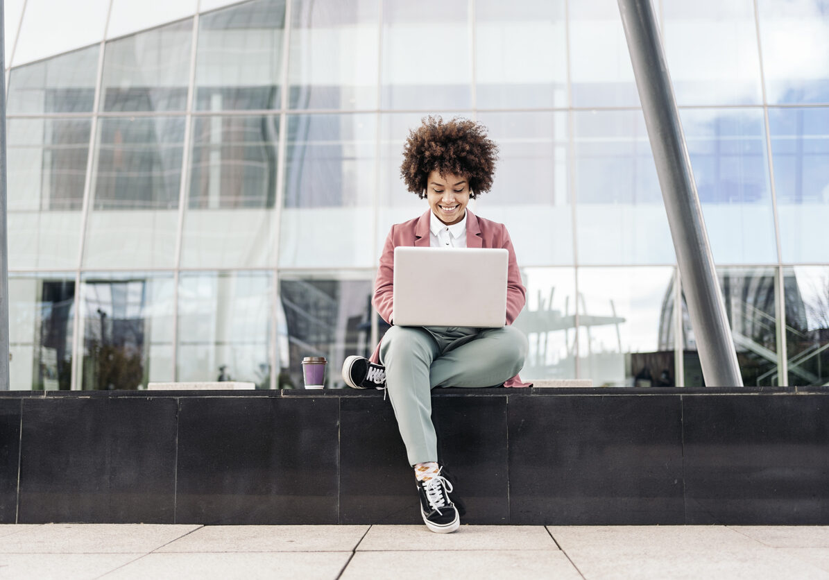 Business Woman Using Laptop Outdoors