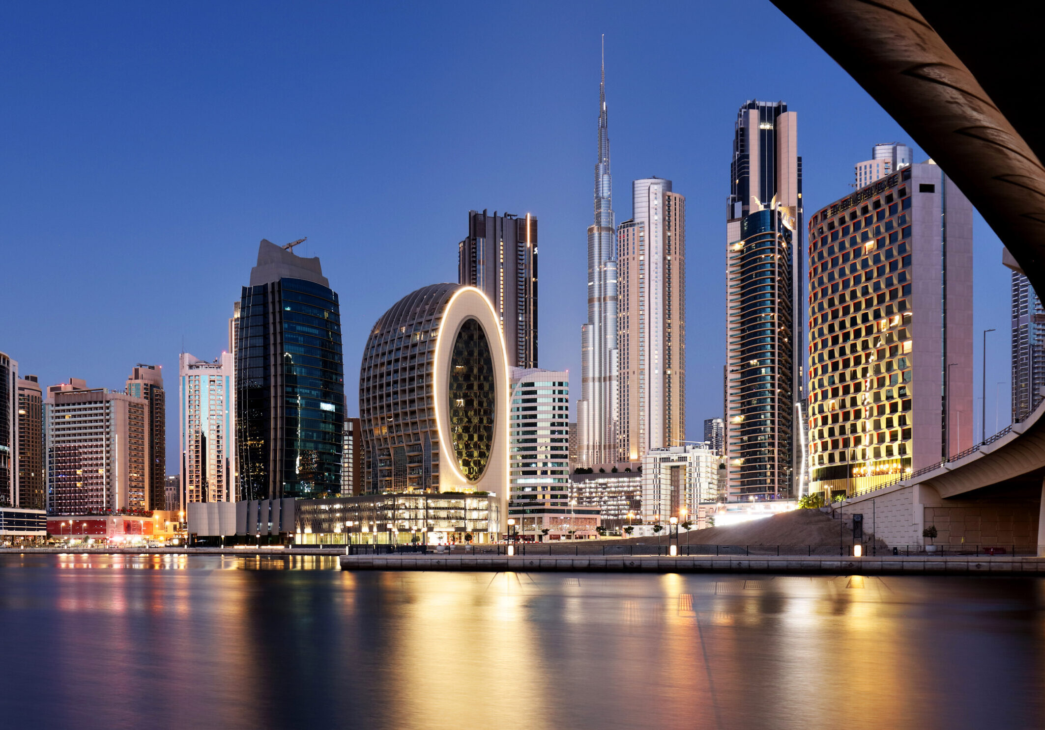 Panaroma of Dubai skyline with Burj khalifa and other skyscrapers at night from Al Jadaf Waterfront; UAE