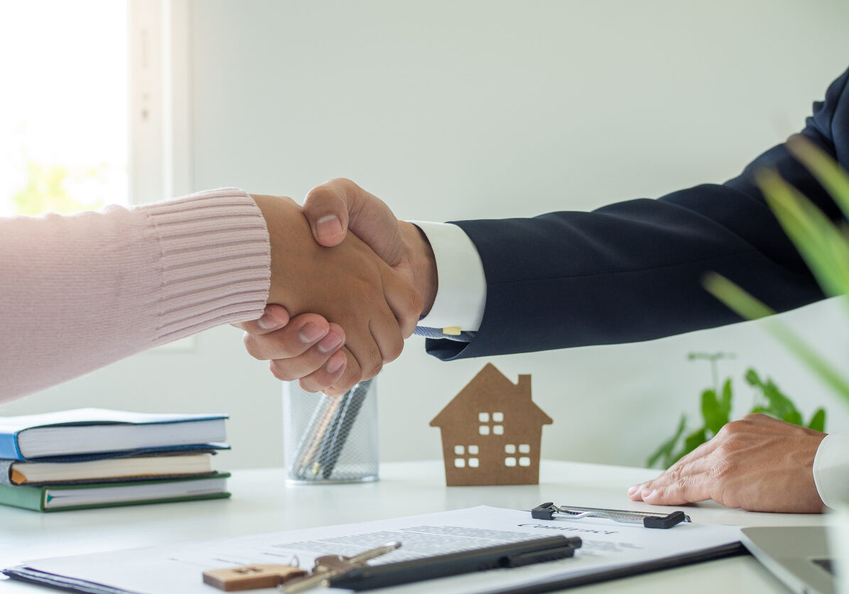 lease, rental and selling home. Real estate agent manager smile holding key for new owner.  rent house, Sales, loan credit financial, insurance, Seller, dealer, installment,  buy, sell, move in