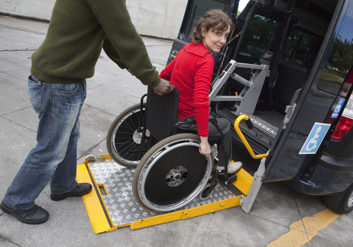 Man helping wheelchair user