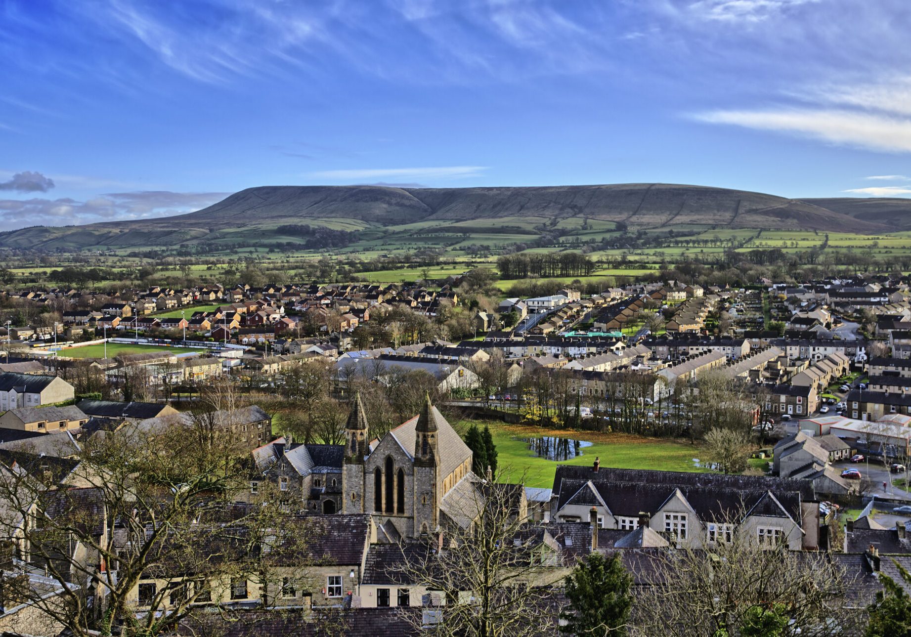 View across Clitheroe, a Lancashire town of Saxon origin, looking towards Pendle Hill, a plateau of Pendle Grit;a coarse carboniferous sandstone, overlaying carboniferous limestone with slopes of boulder clay.