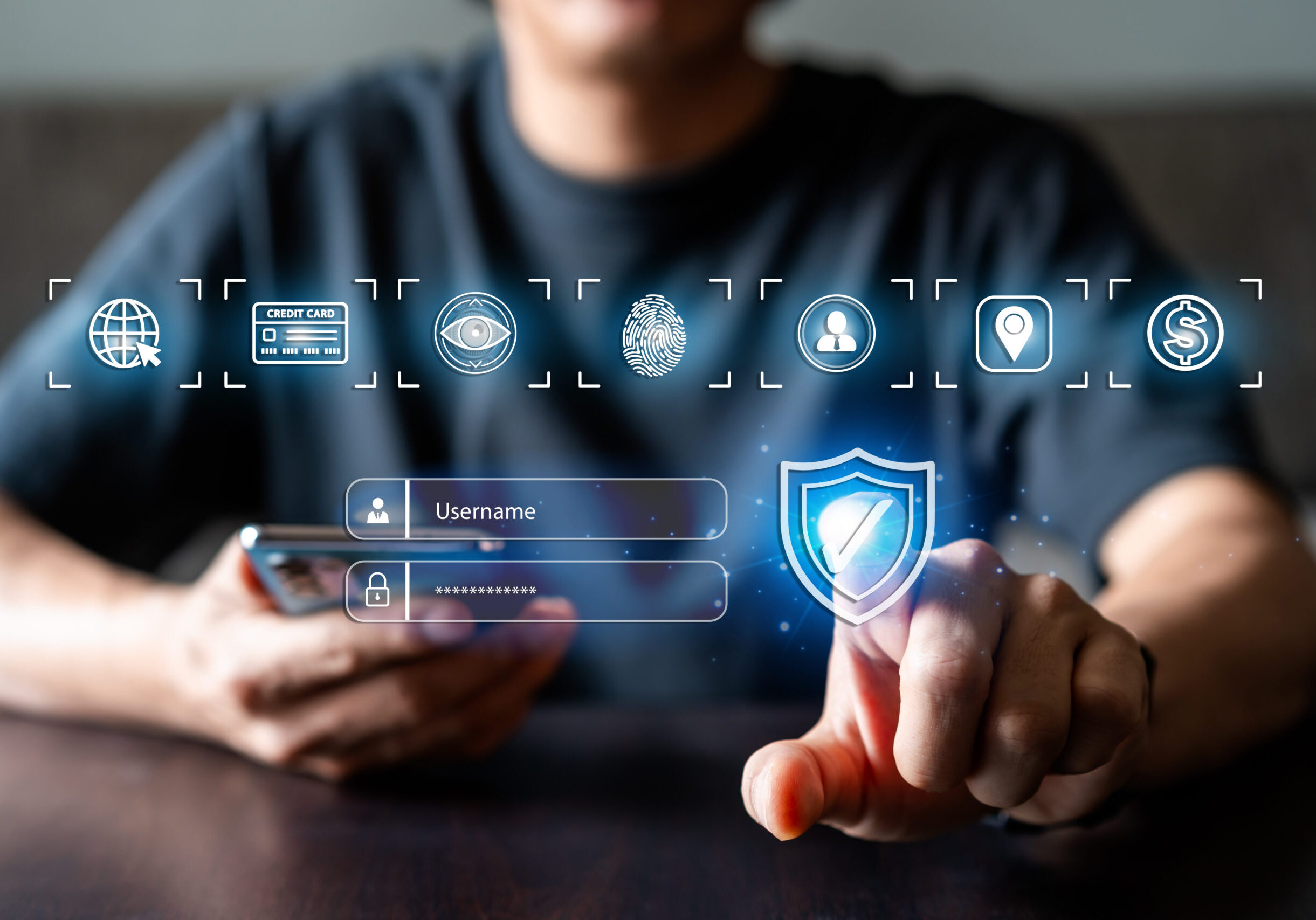 Young man using smart devices with global network connection and cyber security business data protection technology