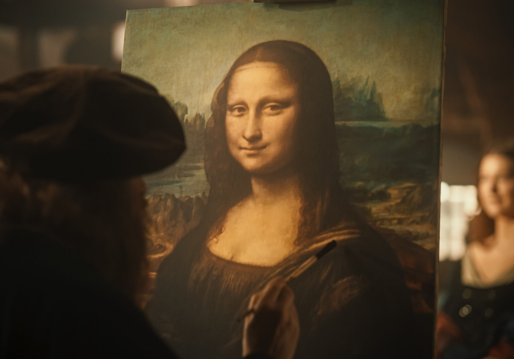 Close Up on The Painting of the Mona Lisa Being Created by Leonardo da Vinci in his Workshop. Renaissance Era Historical Figure and Painter Gently Adding Details to his Masterpiece on the Canvas