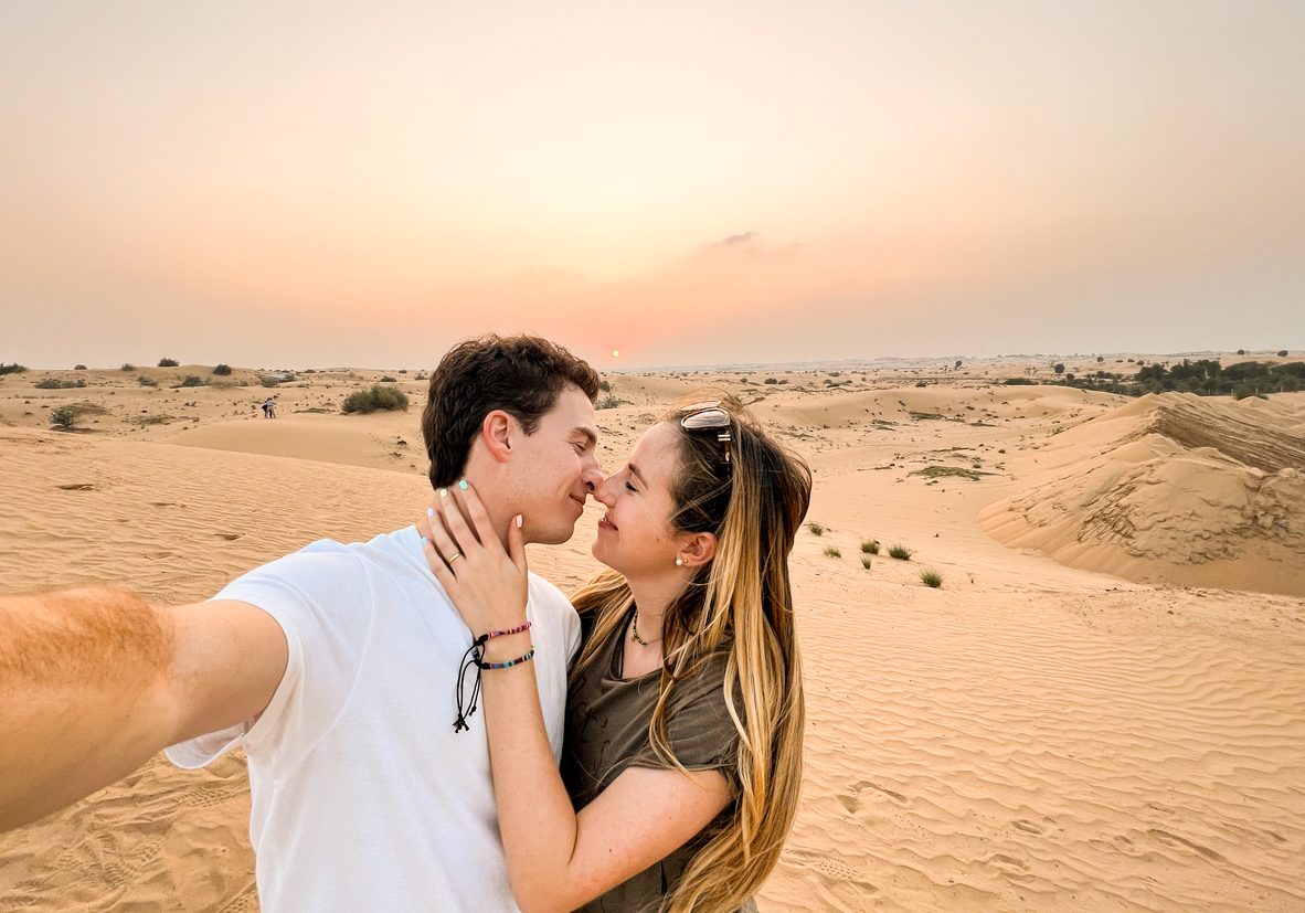 Selfie photo of traveling tourists in love in the desert in United Arab Emirates