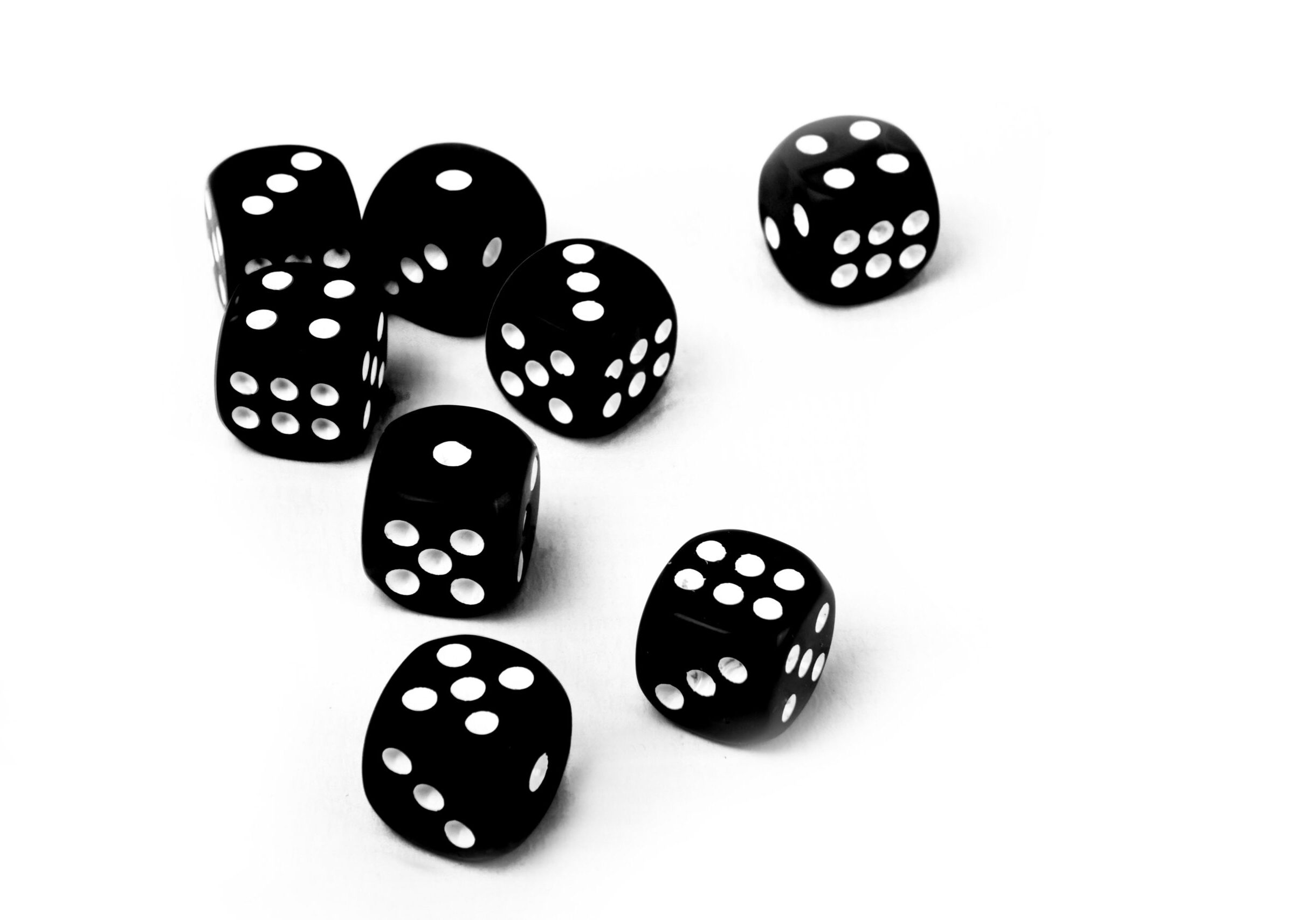 close up of black dices isolated on white