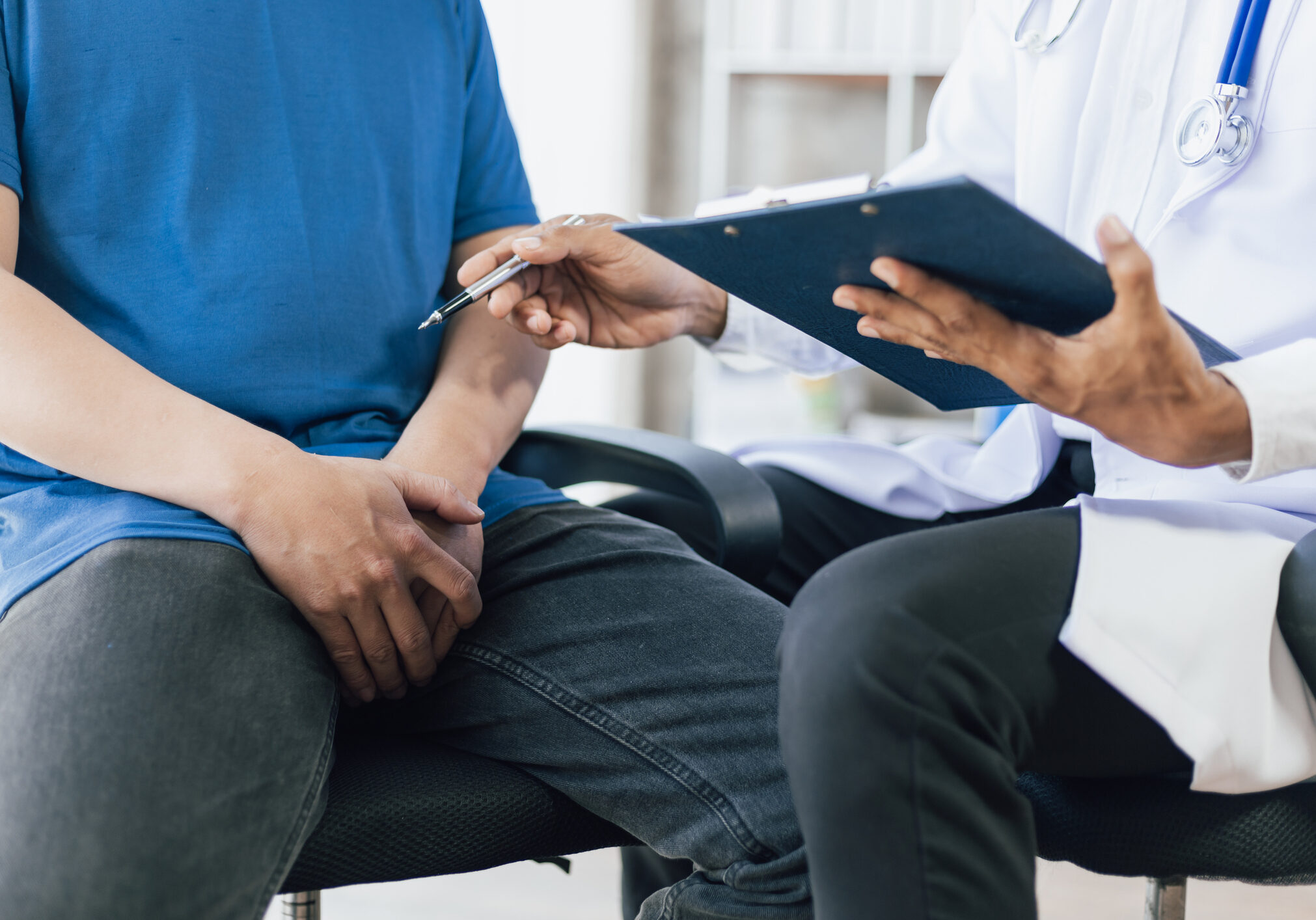 The doctor is diagnosing and giving advice on treating male erectile dysfunction. Concept of male health problems.