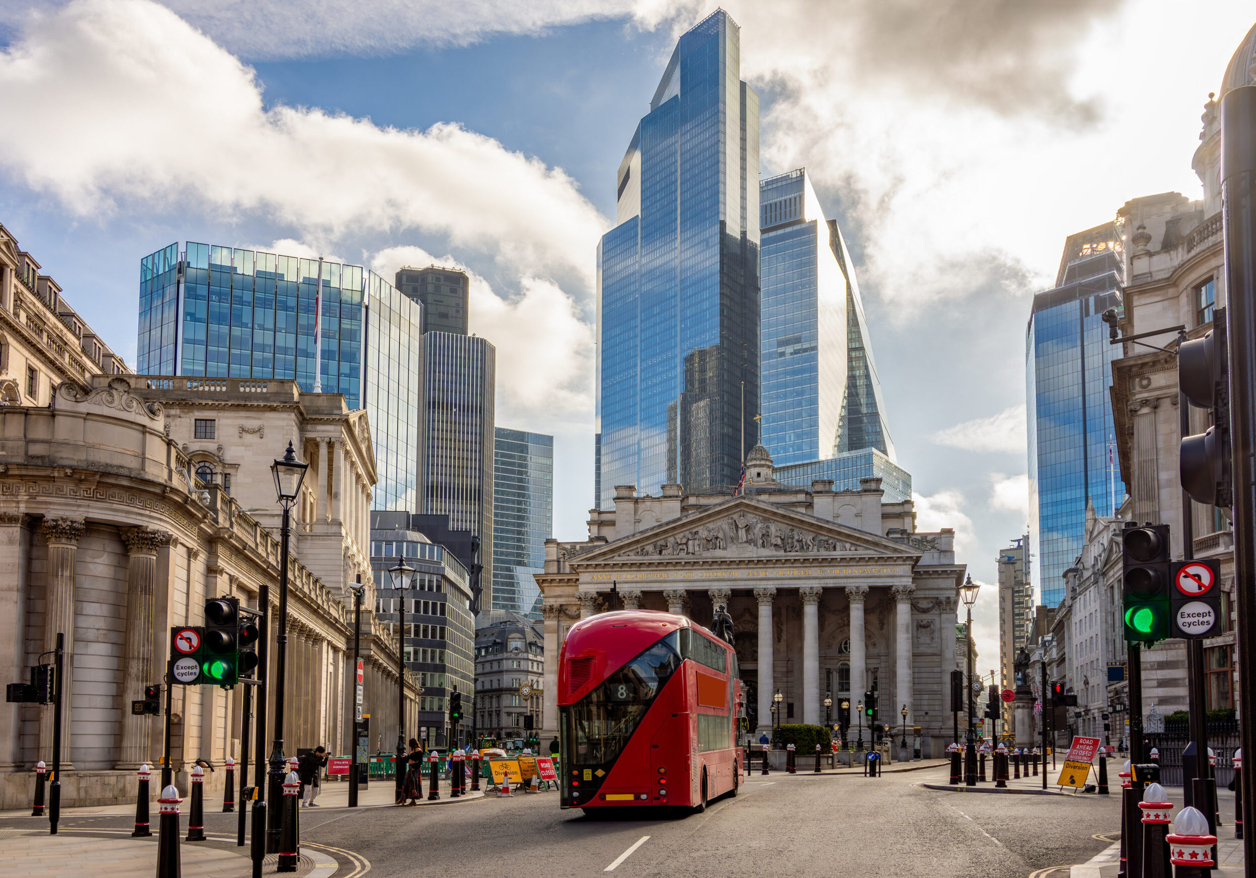 Royal Exchange building and skyscrapers in City of London, UK