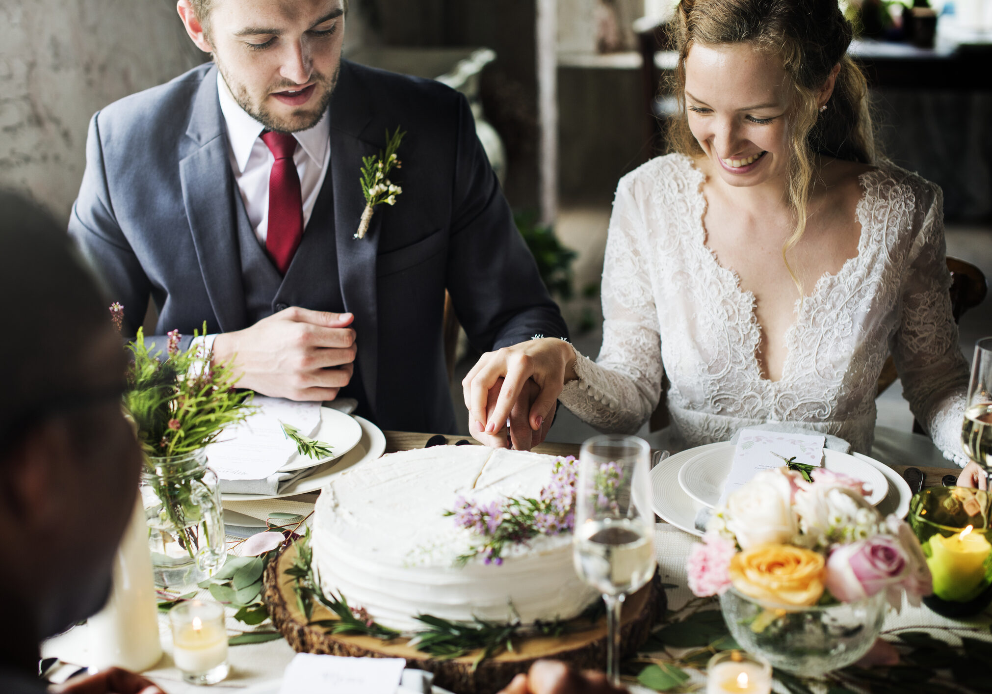 Bride and Groom Cutting Cake on Wedding Reception