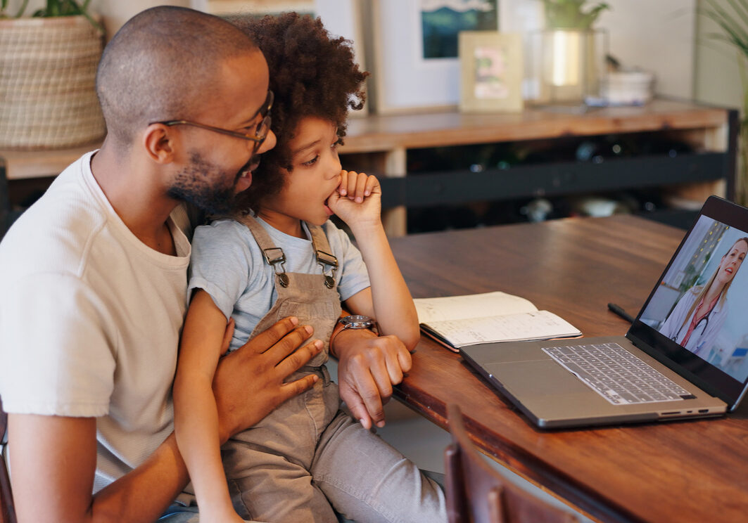 Child, black man and laptop screen with doctor for telehealth service, communication and advice. Home, boy and father with pediatrician on tech for medical support, discussion or virtual consultation