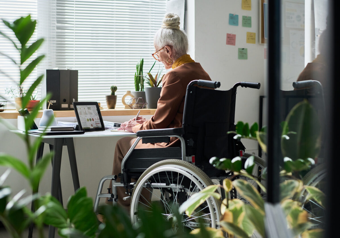 Senior Woman Working from Home in Wheelchair
