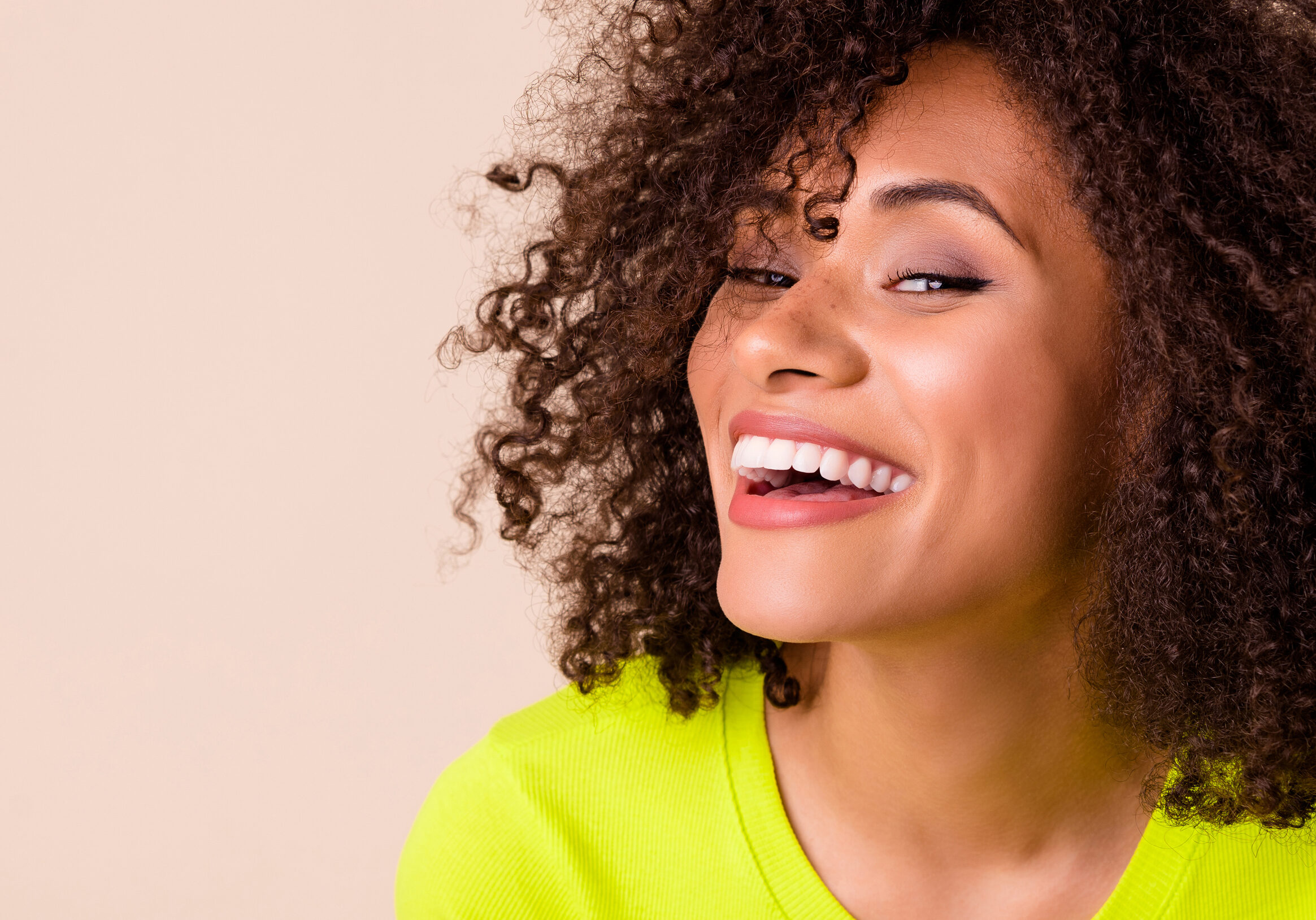 Closeup photo of young attractive crazy smiling girl looking you healthy funny isolated on beige color background.