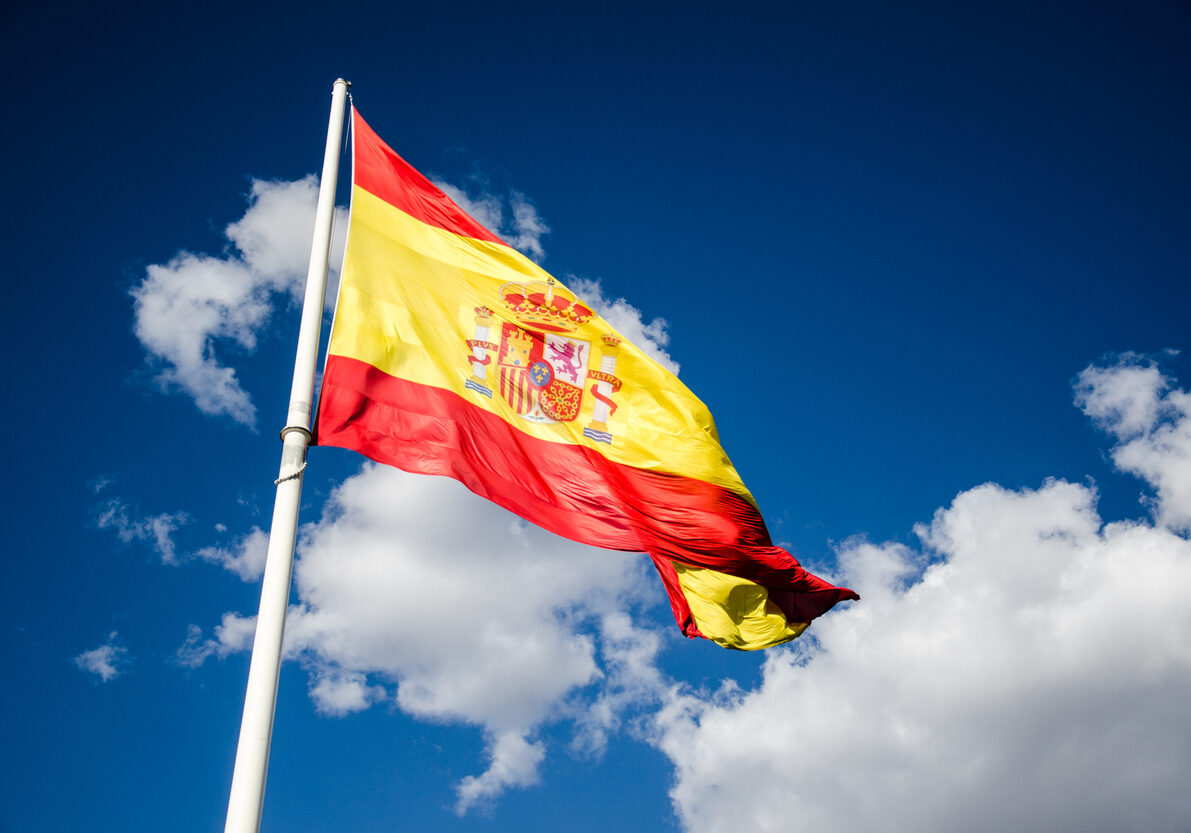 Spanish flag waving in the wind. This photo is taken in Plaza de Colón, Marid.