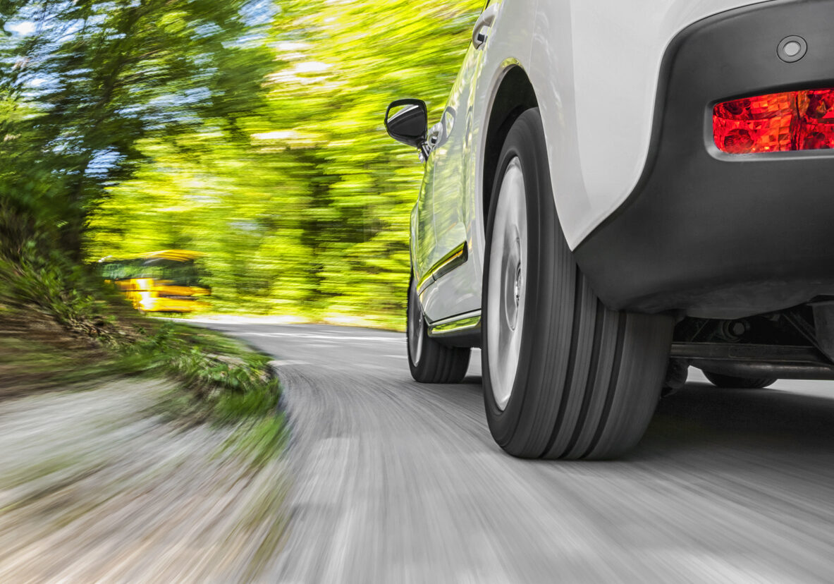 Low angle shot of a car driving on the road
