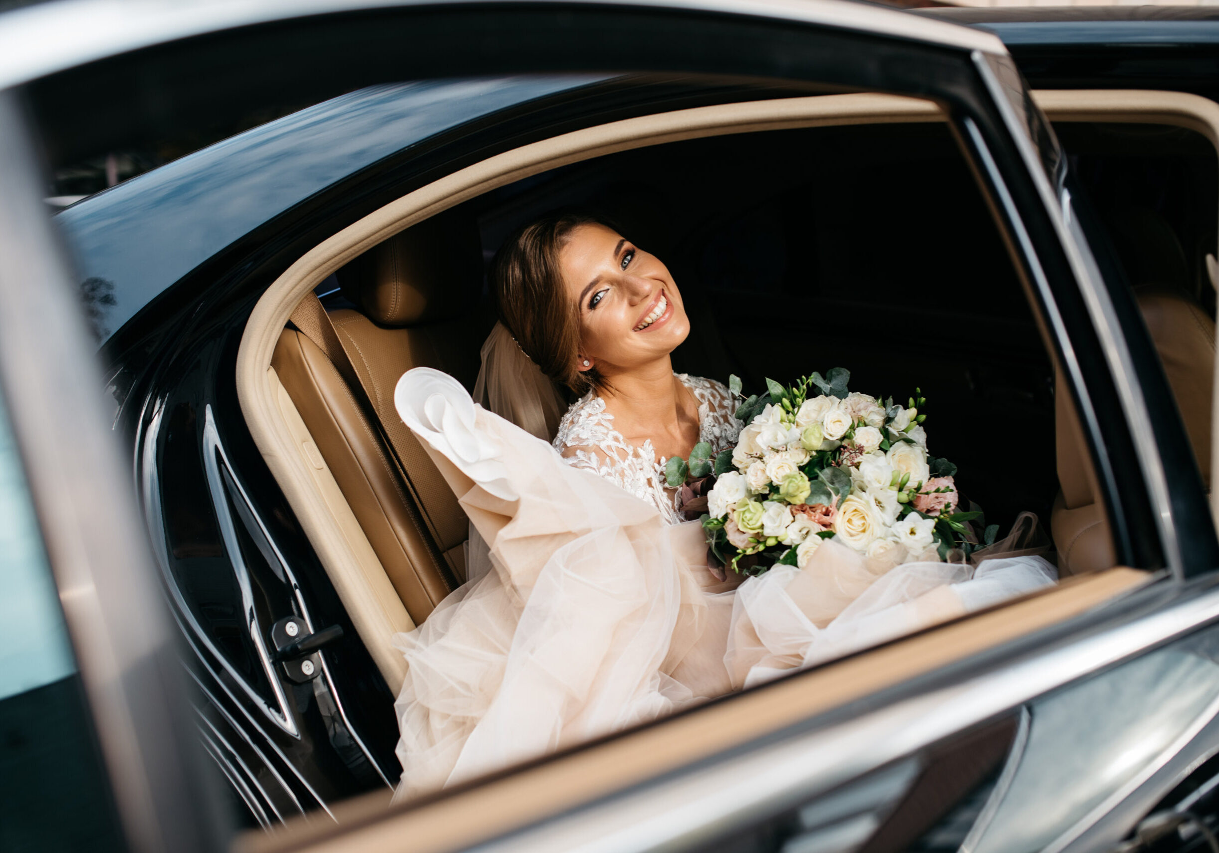 Happy bride on the day of his marriage poses for photographers