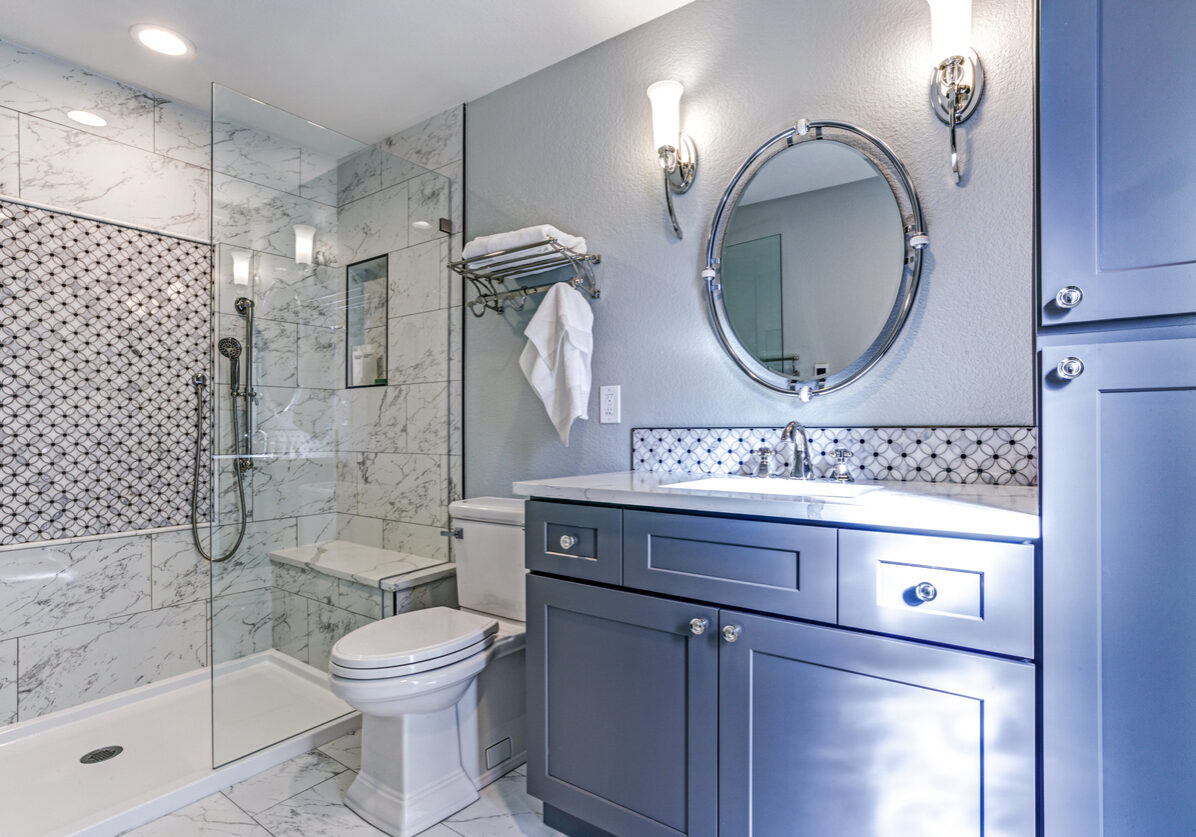 Luxury bathroom design with Marble shower Surround and mosaic accent tiles.