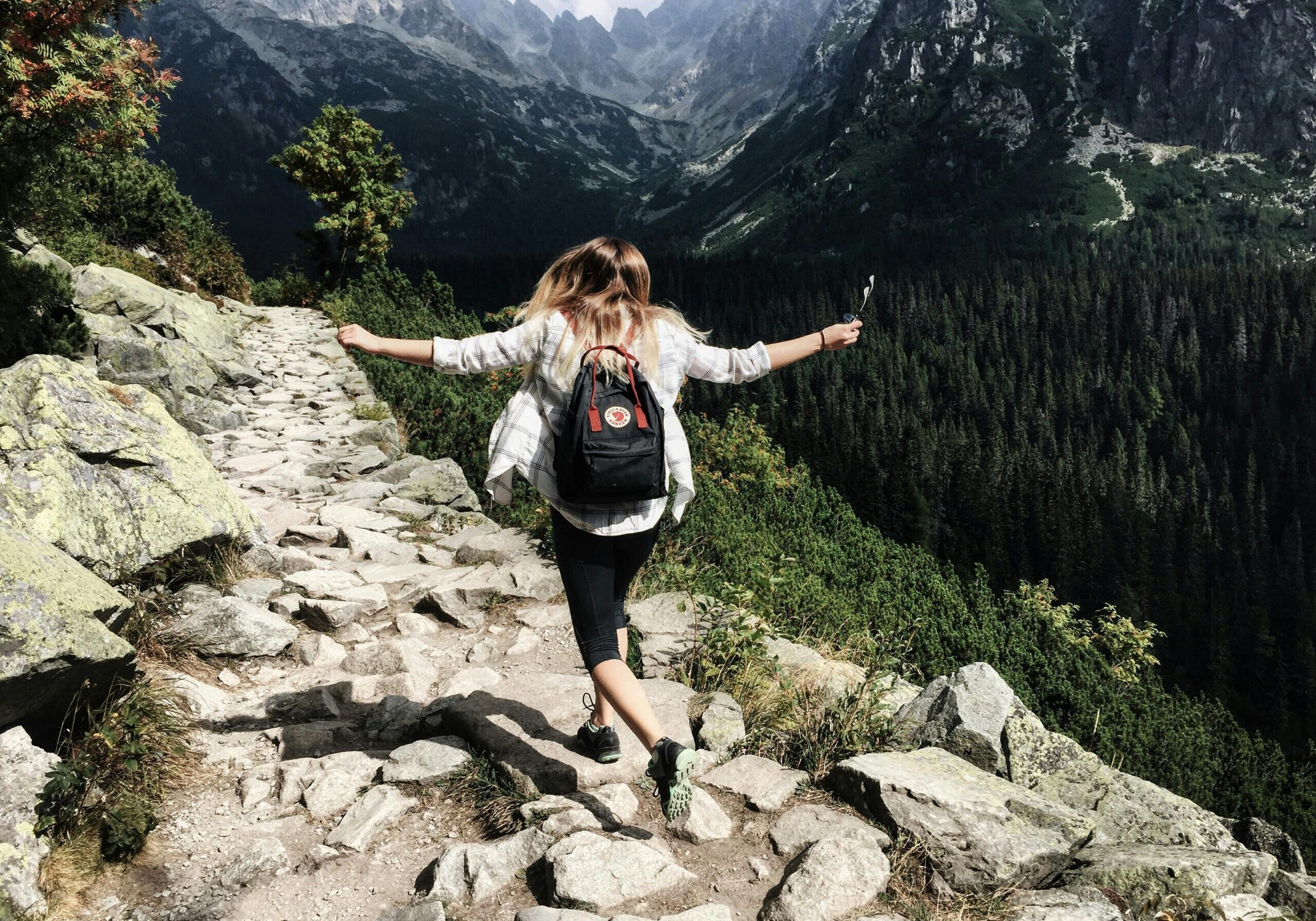 Photo by Nina Uhlikova: https://www.pexels.com/photo/woman-standing-on-cliff-287240/